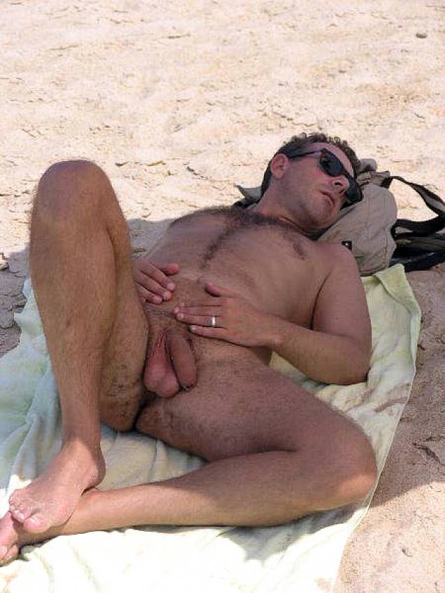 2. Sunbathes nude men on the beach. 
